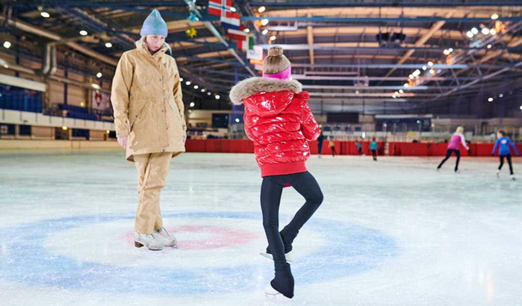 Image of a ice skater taking a private lesson